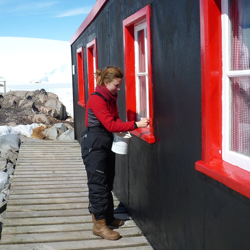<p>Port Lockroy being repainted in 2011 (Credit: Cat Totty/UKAHT)</p>